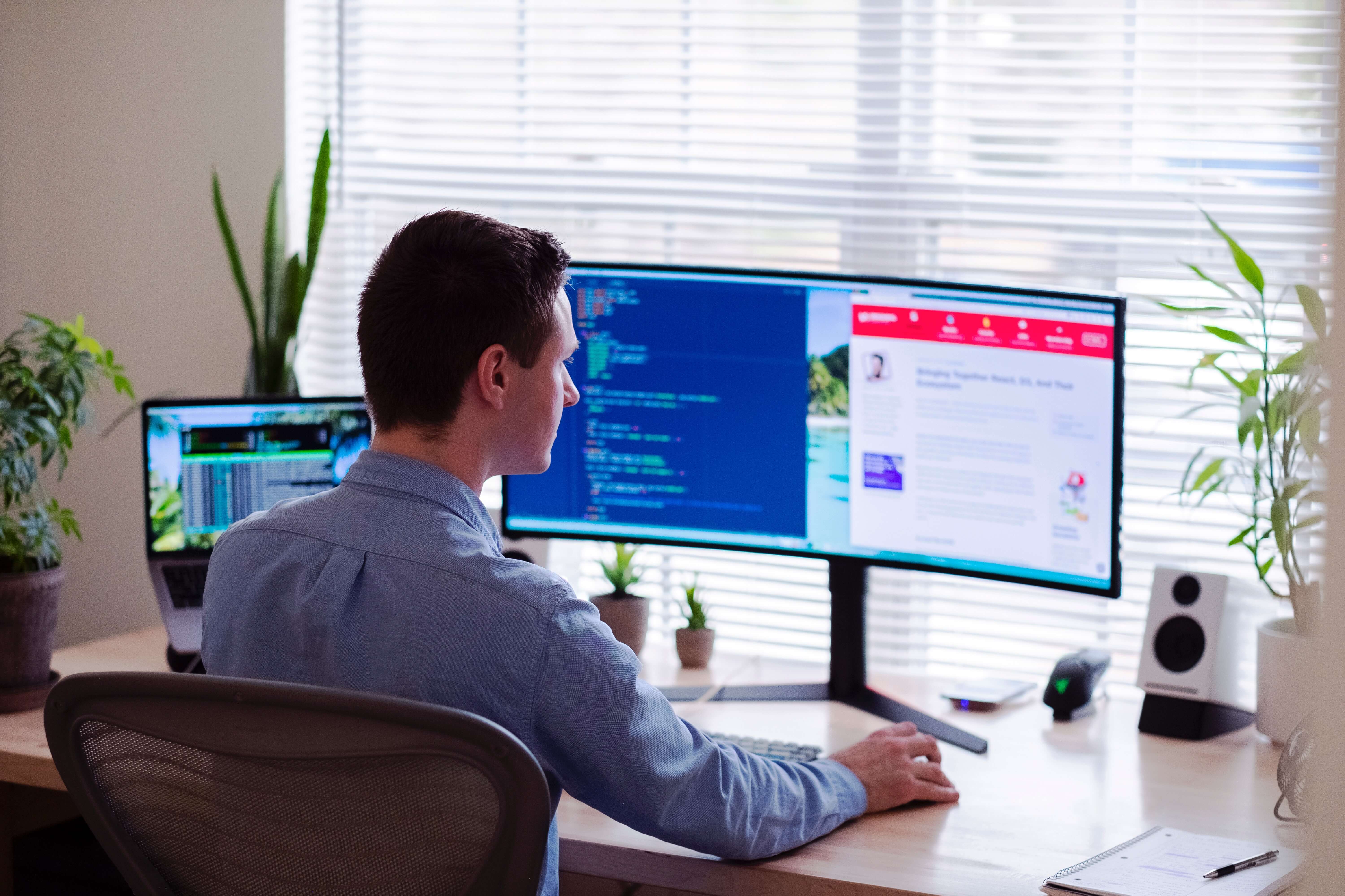 Man looking at software on a computer