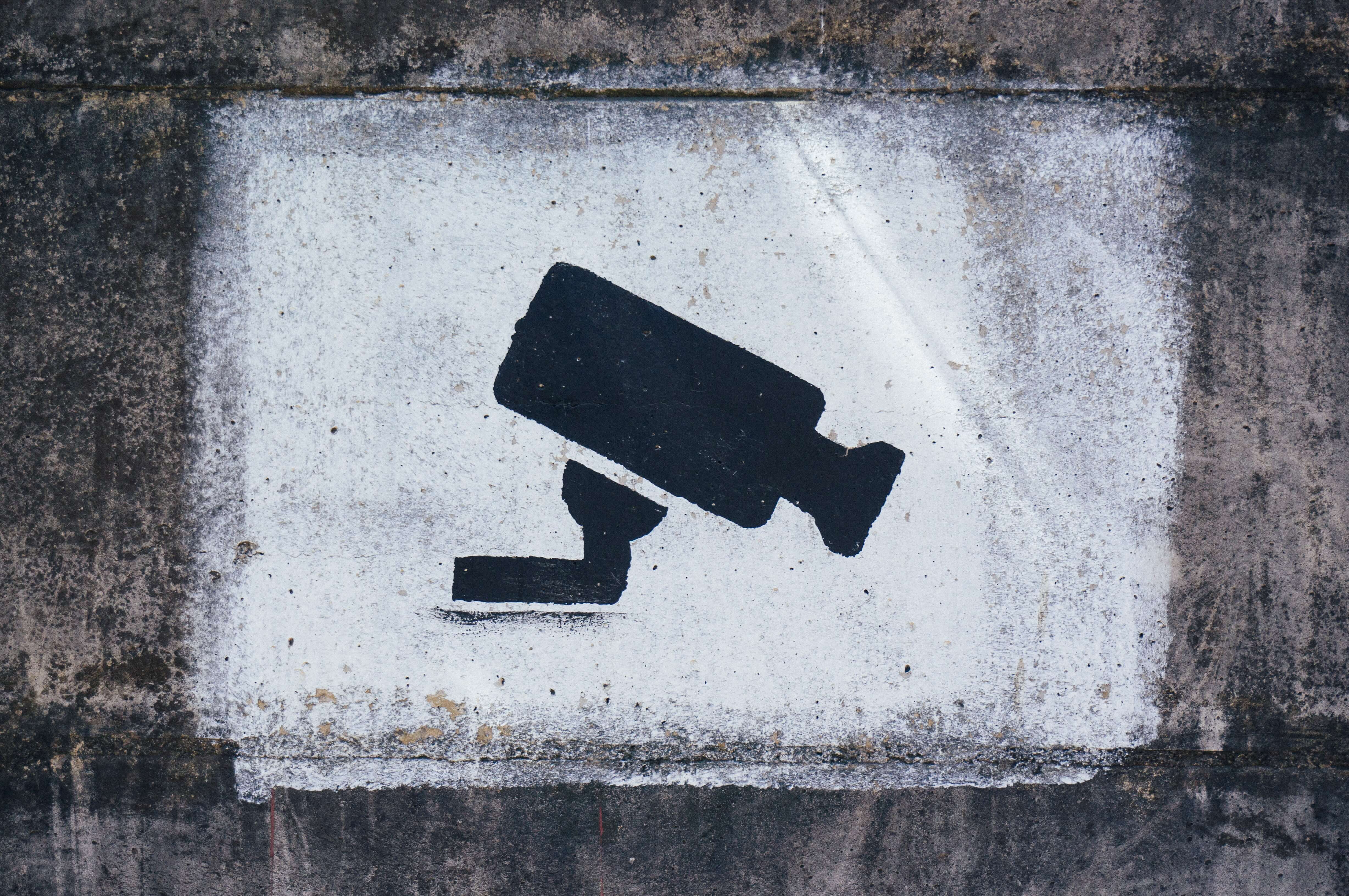 camera spray painted onto a wall